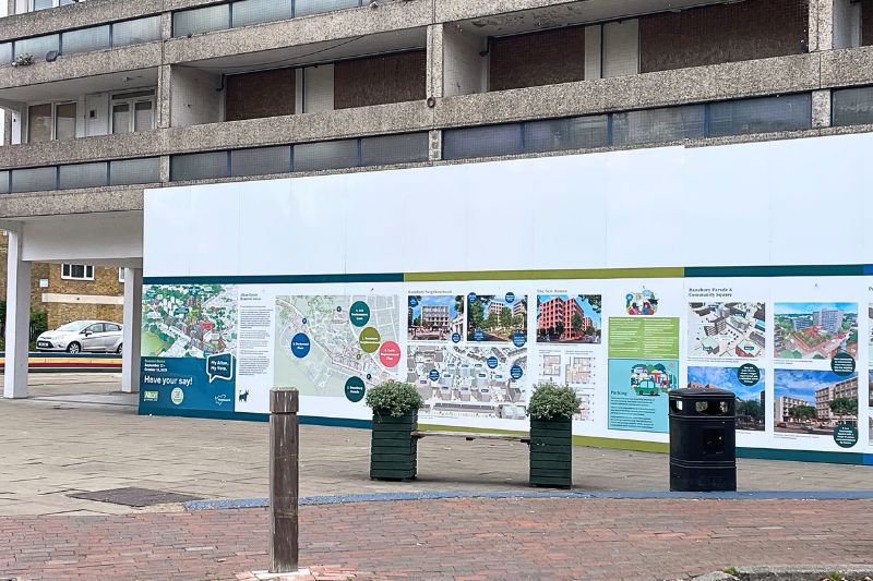 Hoardings outside the old Co-op building, which feature colourful plans for the Alton