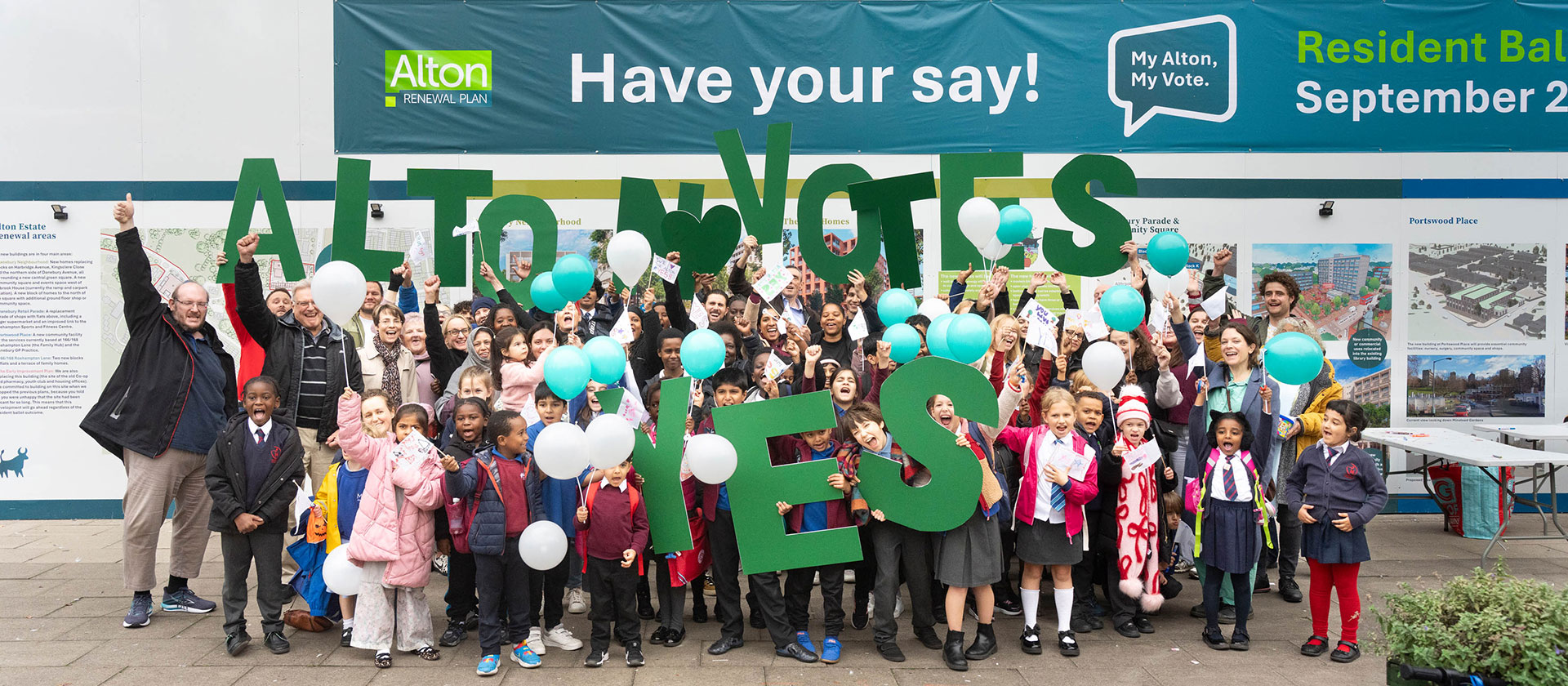 Simple illustration of hands held in the air, some of which are holding voting papers.