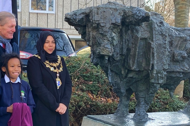 Student Jeremiah from Alton School helps unveil the Bull with the Mayor of Wandsworth