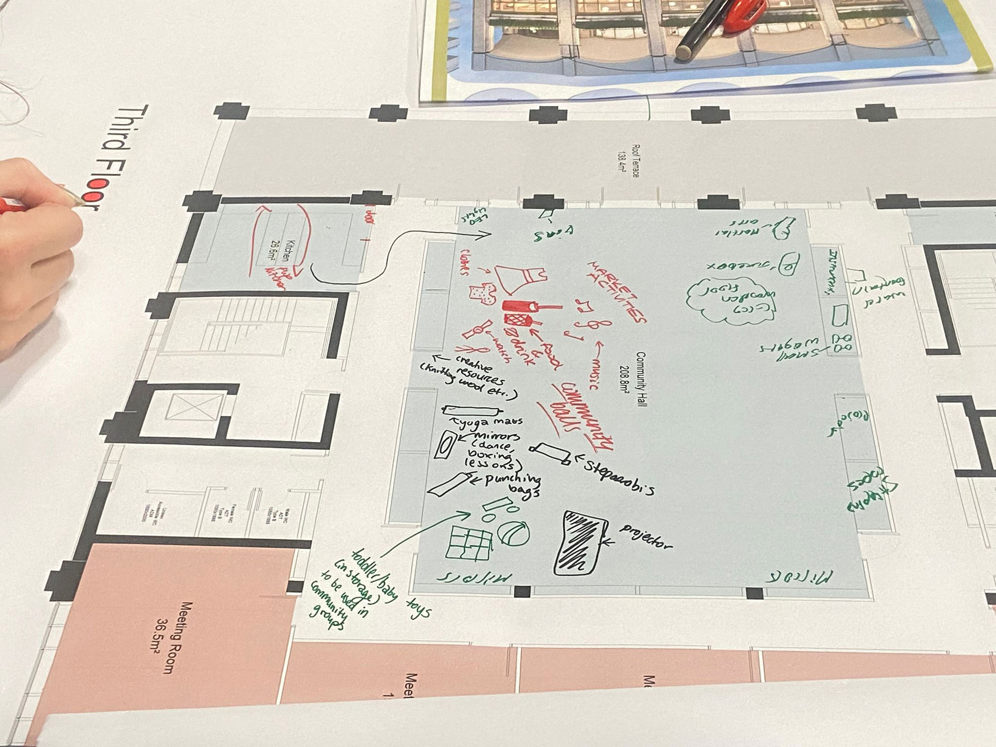 The image shows a proposed floor plan of the new community building